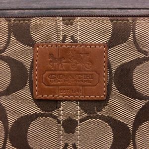 Coach wristlet brown and tan monogram CC design
